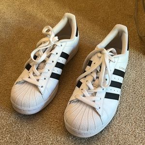 Adidas womens white with black stripes leather sneaker.